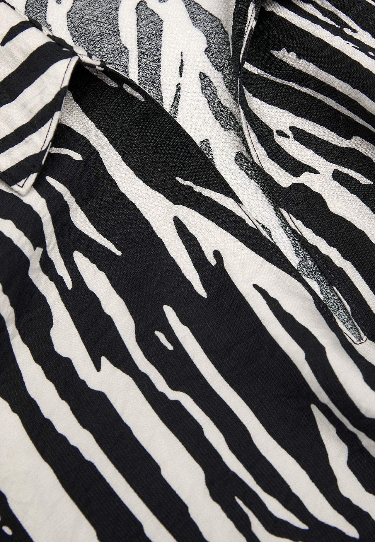 Gevlochten tuniek met lange mouwen