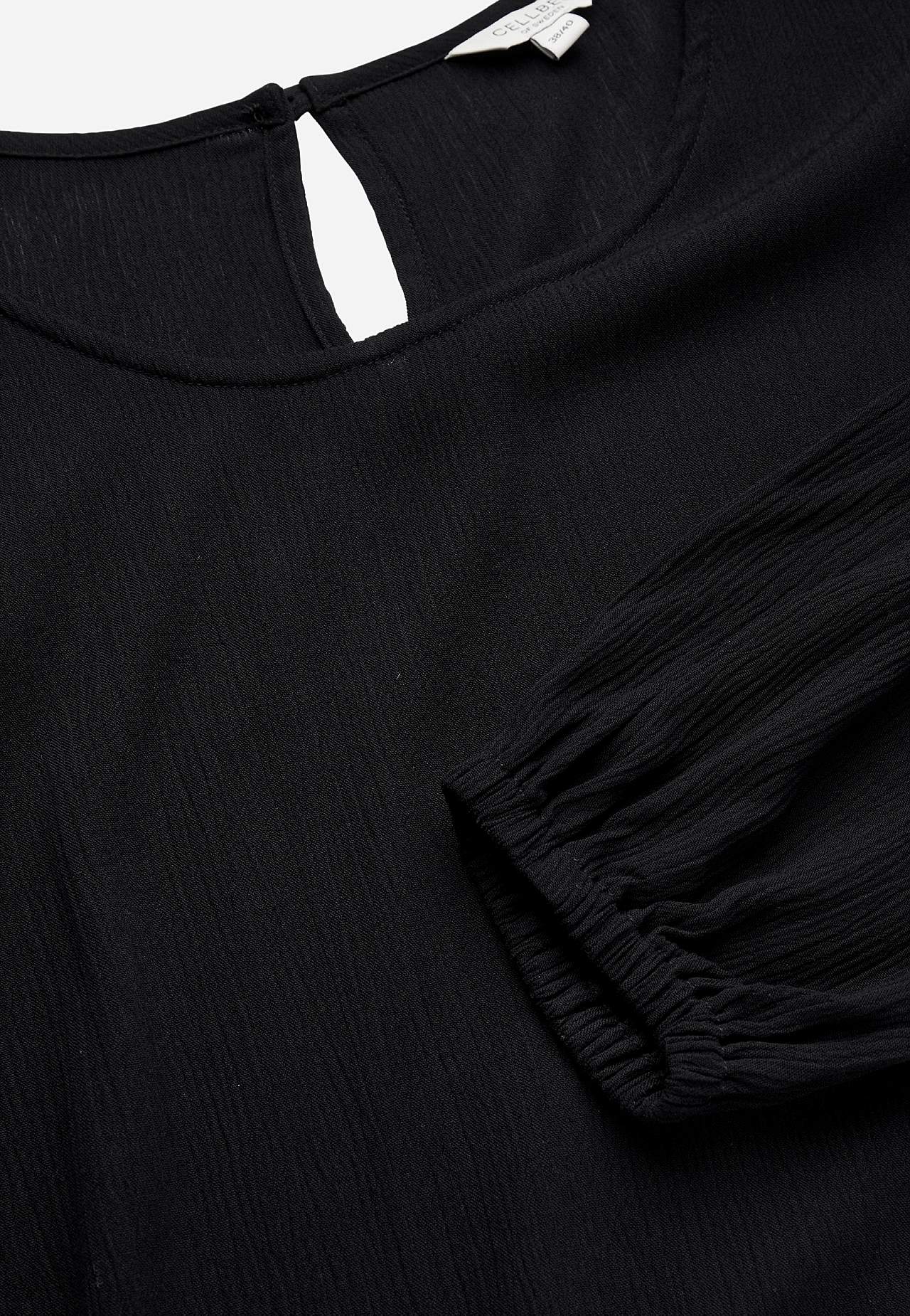 Tuniek met getextureerd gevlochten stof