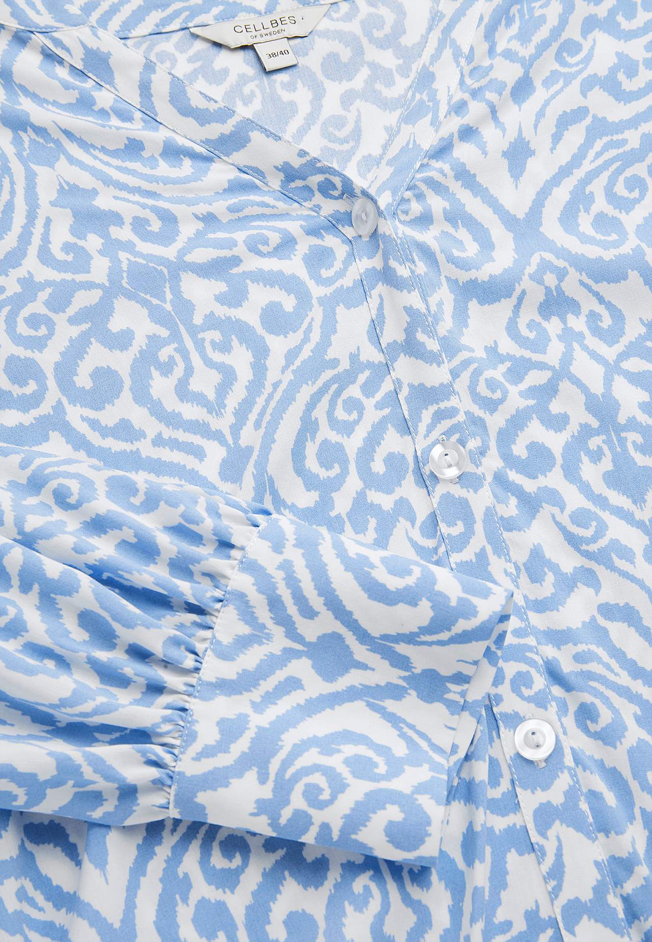 Gevlochten tuniek met knoppen