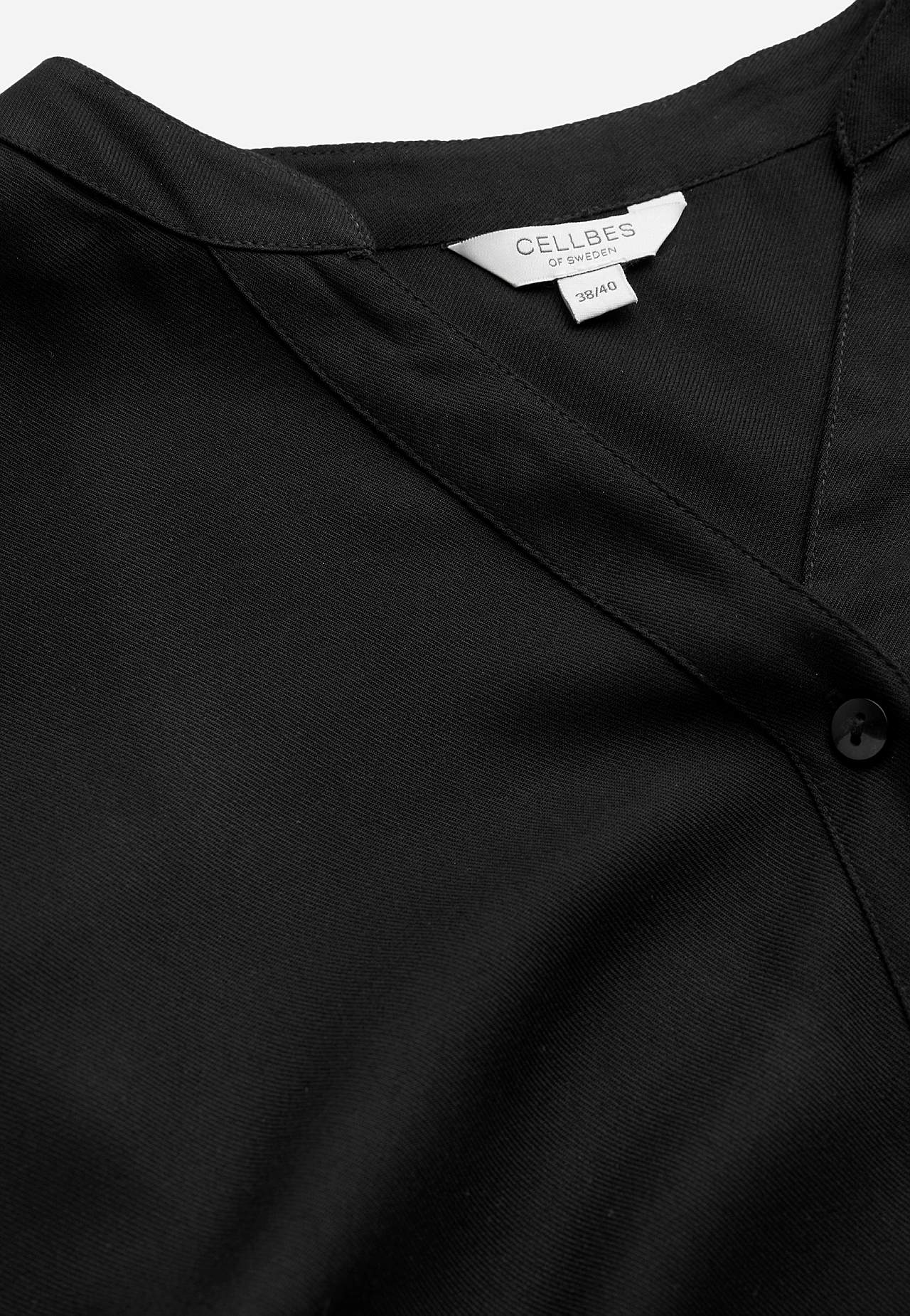 Gevlochten tuniek met knoppen