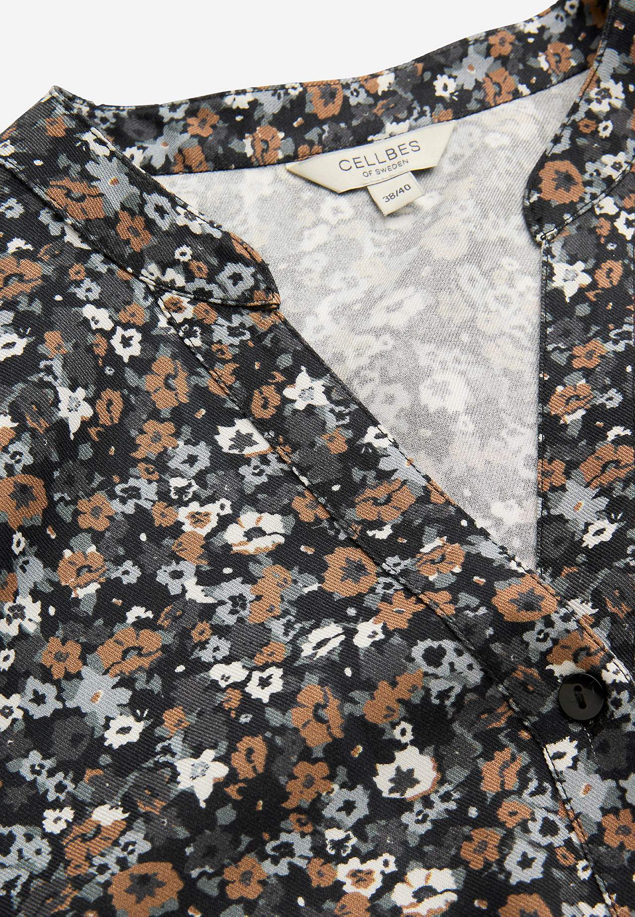 Gevlochten tuniek met knoppen