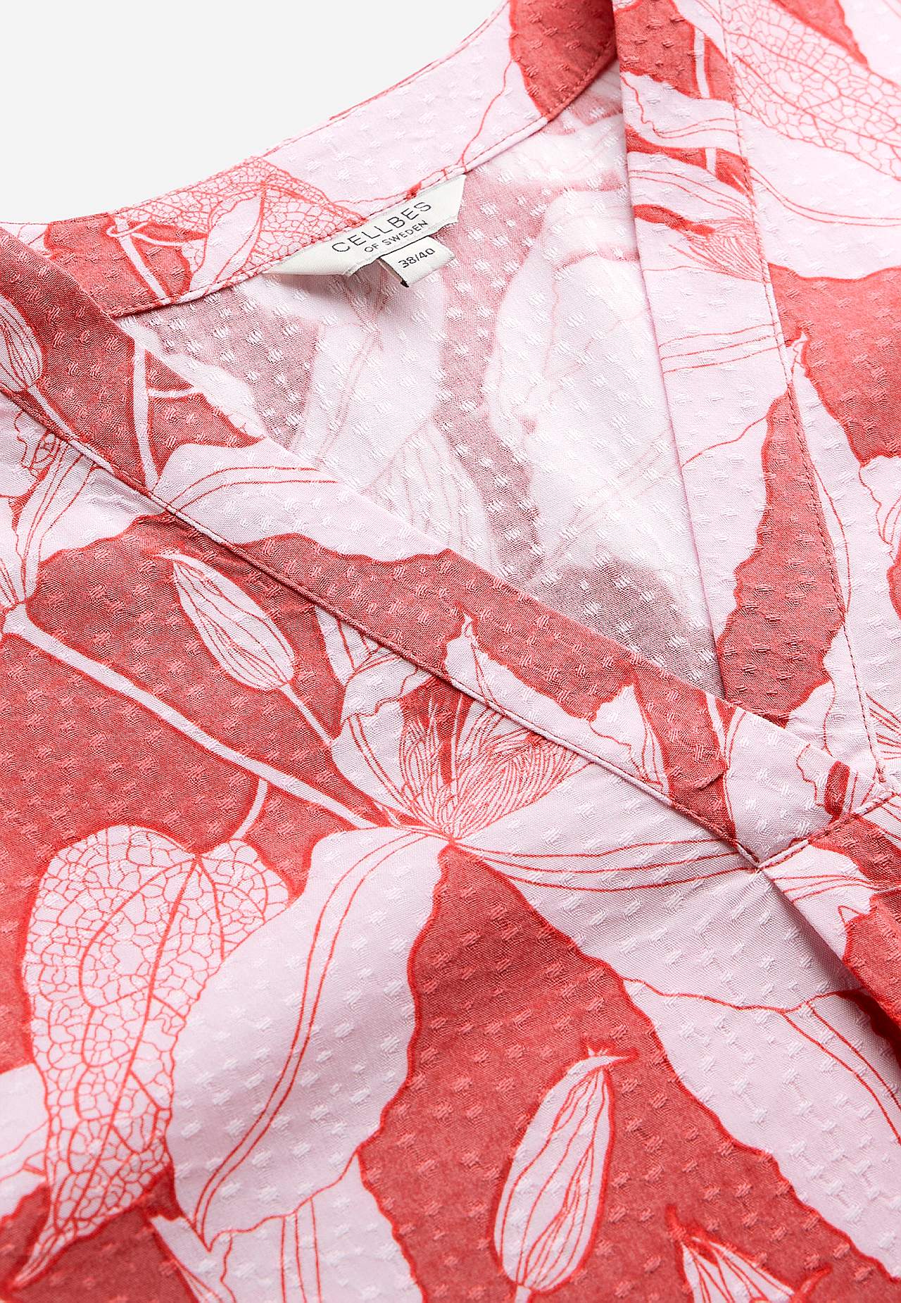 Gevlochten bloes met pofmouw