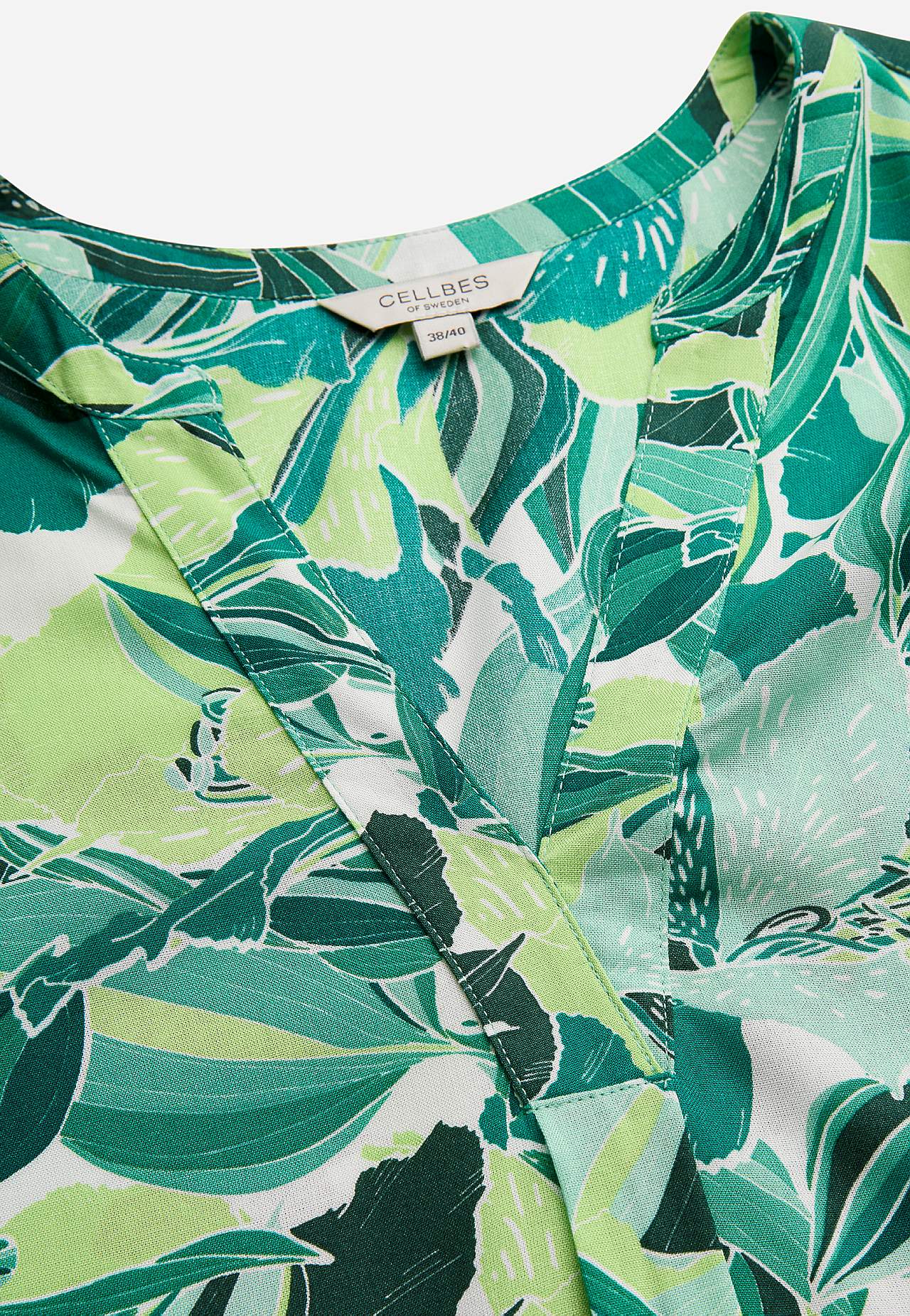 Mouwloze tuniek met zakken en een bloemenpatroon