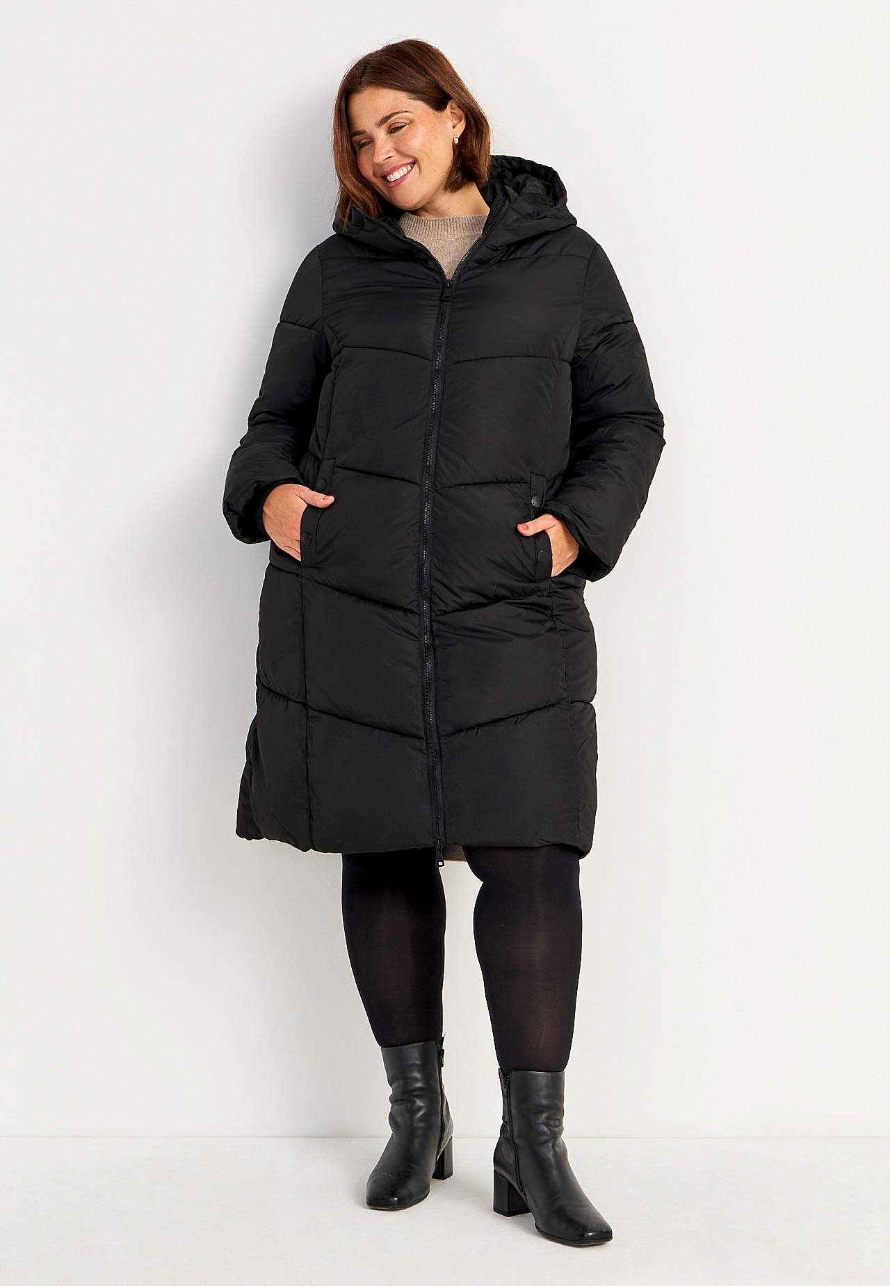 Lange jas met pluizige vulling