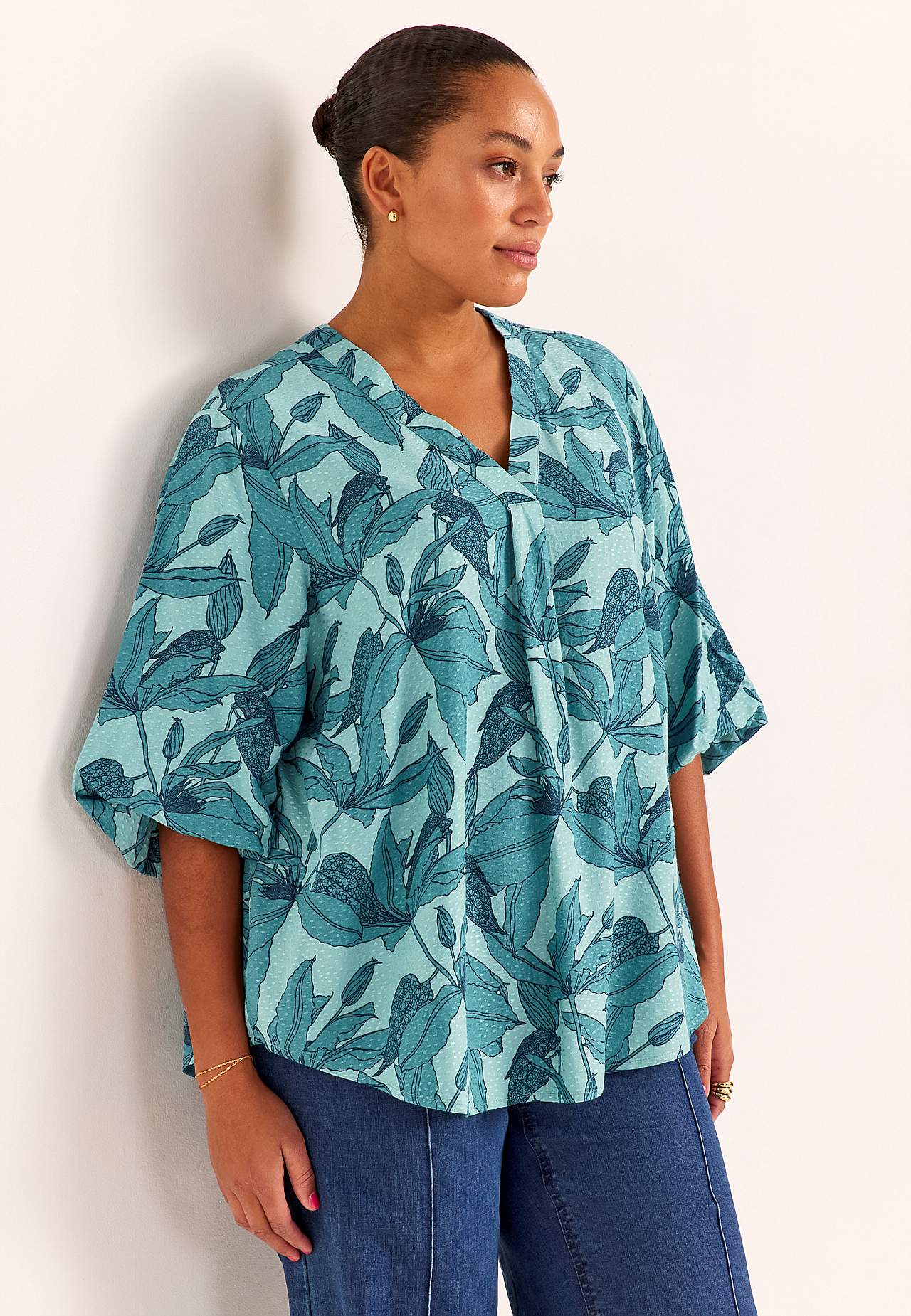 Gevlochten bloes met pofmouw