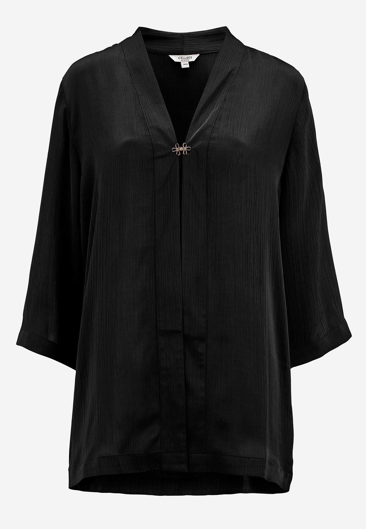 Open feesttuniek met gouden gesp