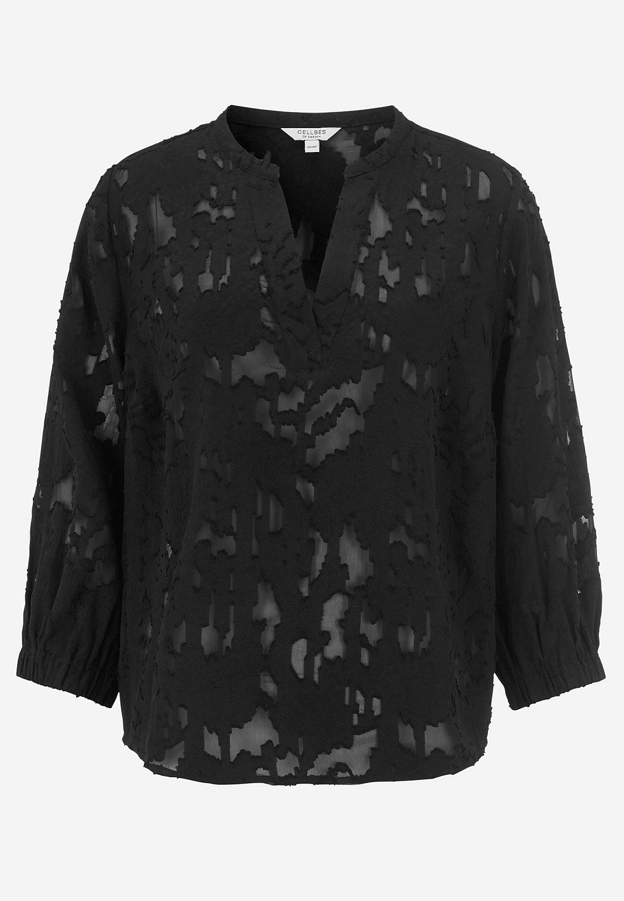 Jacquardgewevene en doorschijnende bloes